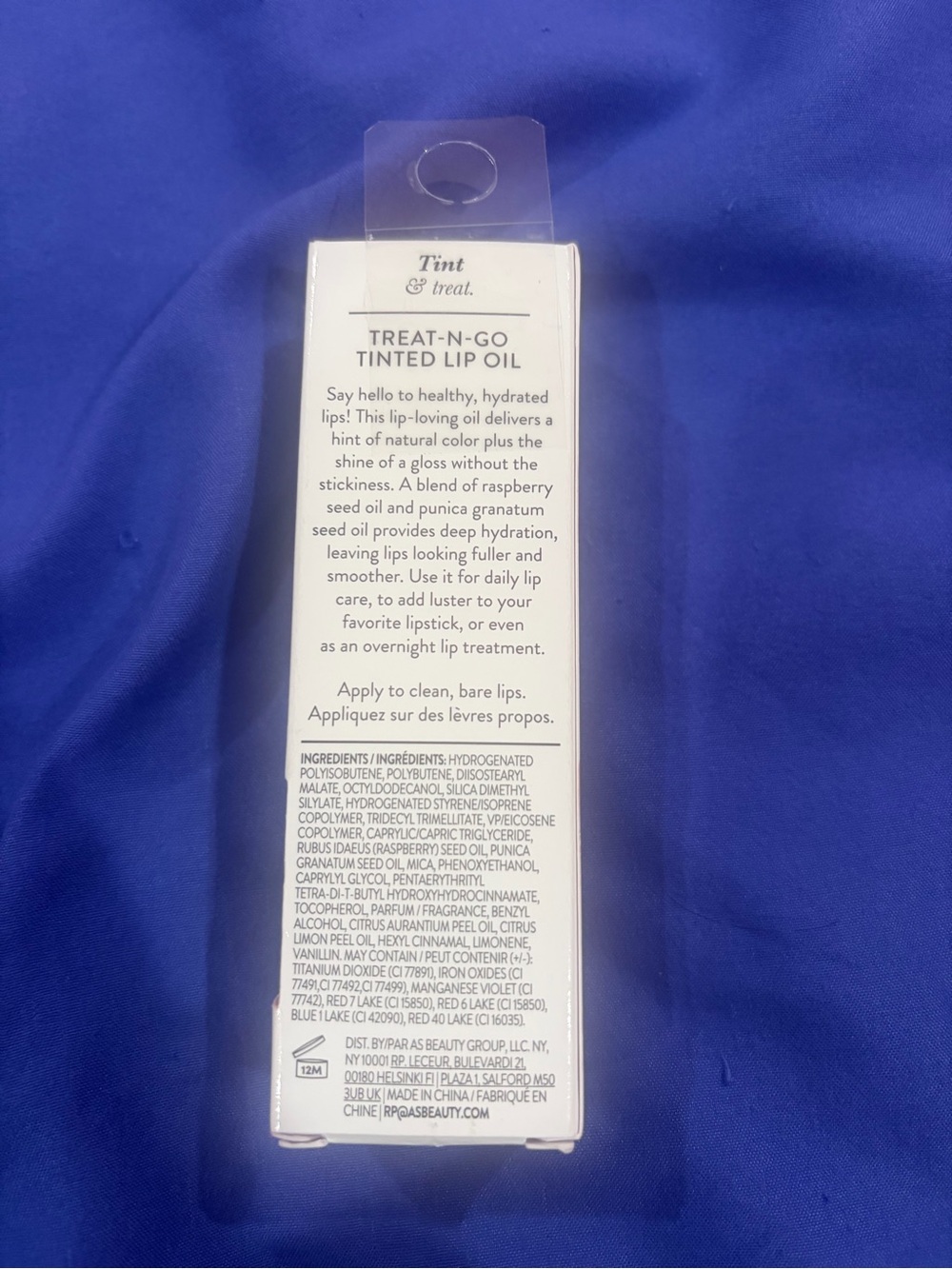 Laura Geller Treat-N-Go Tinted Lip Oil in White Packaging in box Victory Lap - Picture 2 of 5